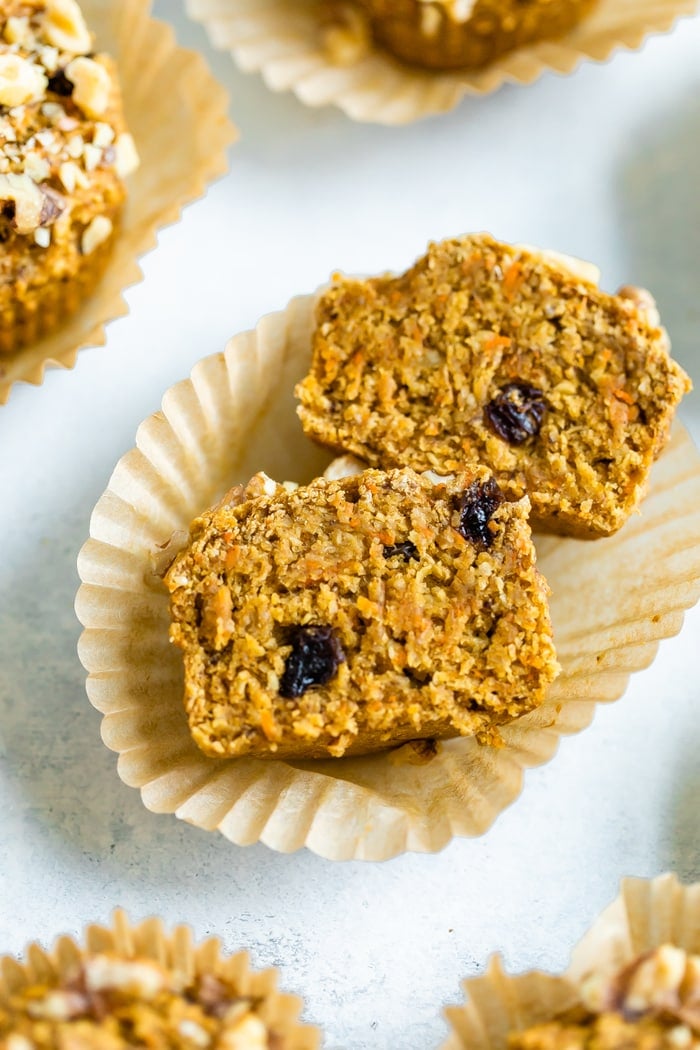 Oat bran muffin cut open. Muffin is made with carrots and raisins.