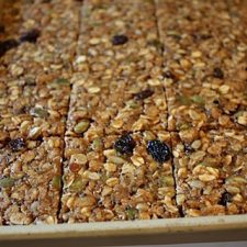 Sheet pan with chewy oat squares cut evenly.