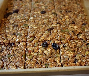 Sheet pan with chewy oat squares cut evenly.