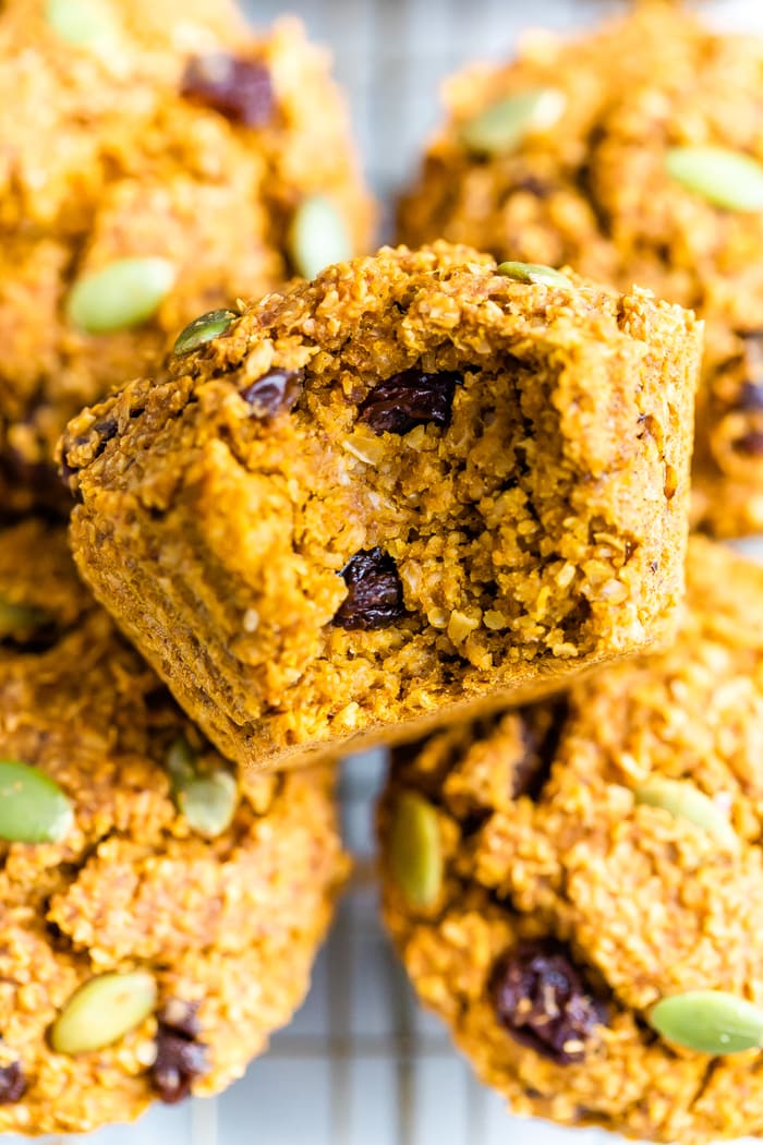 Pumpkin bran muffin with a bite taken out of it.