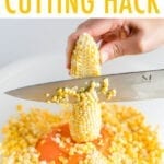 Cutting corn off the cob and into a bowl.