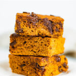 Stack of three pumpkin chocolate chip bars.