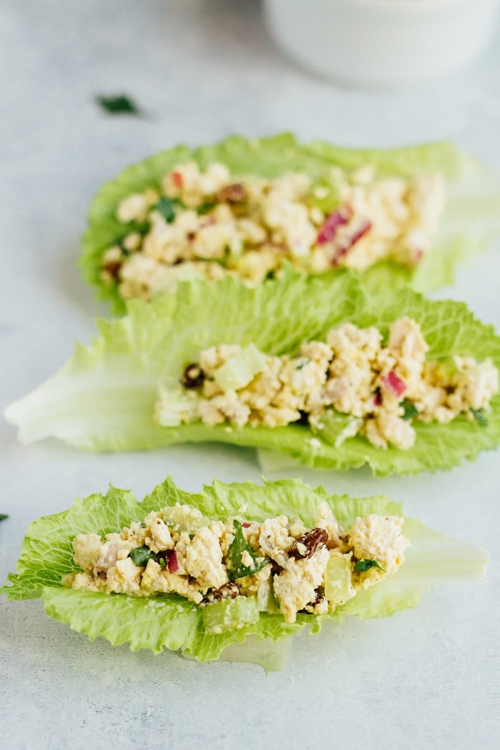 Vegan Chicken Salad made with tofu, celery, almonds and raisins served in romaine leaves.