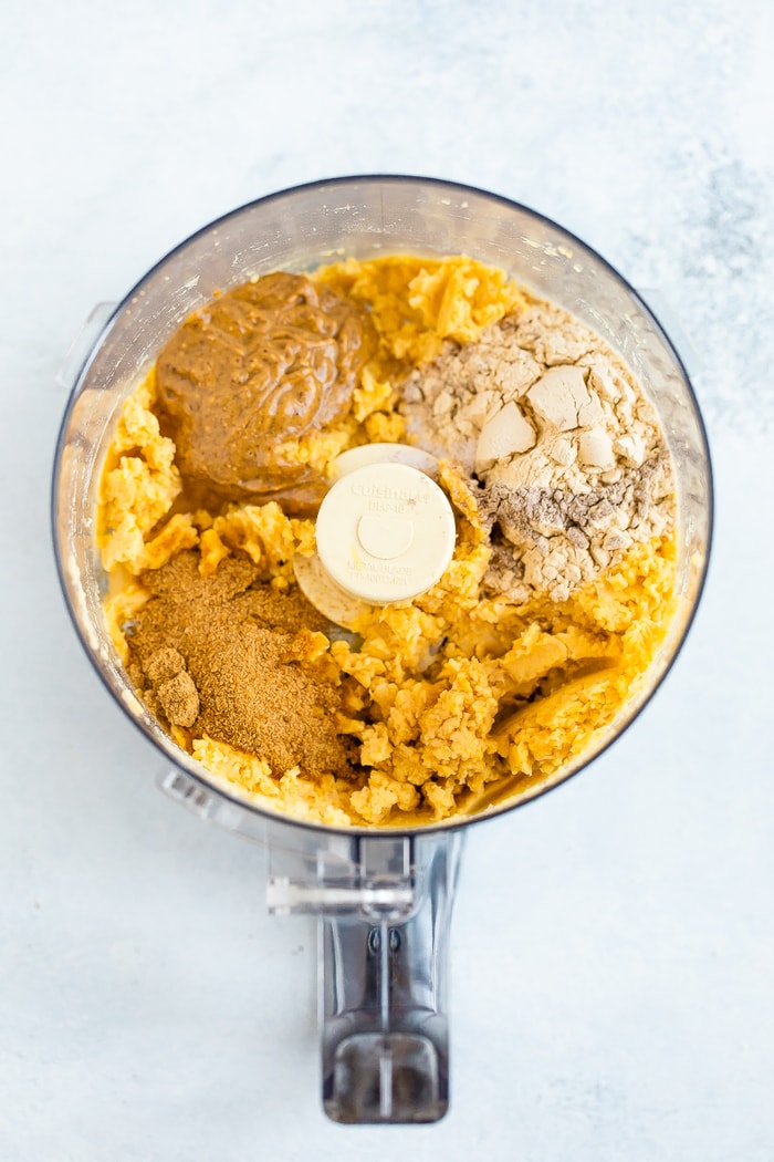 Food processor with the ingredients for healthy chickpea cookies dough.