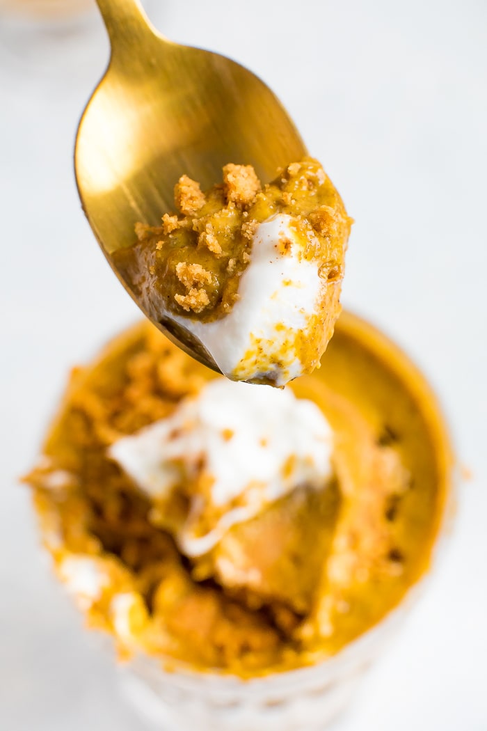 Spoonful of easy pumpkin chia mouse with some yogurt and graham cracker crumbs.