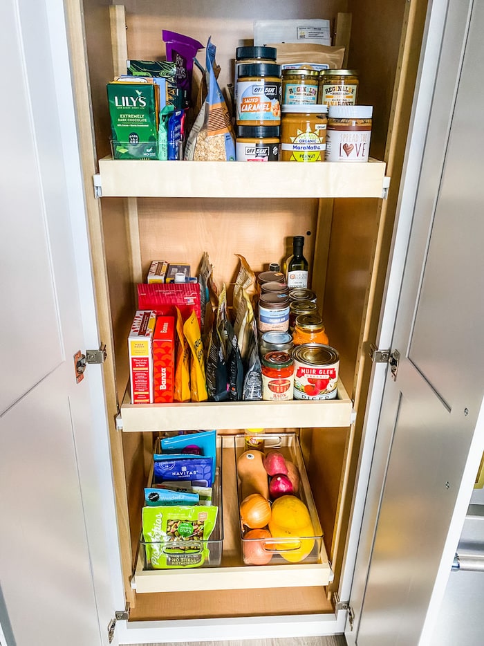 Pantry stocked with canned goods, vegetables and more.