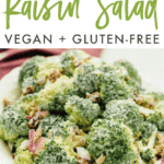 White bowl with vegan broccoli raisin salad on marble countertop. Text above reads "Broccoli Raisin Salad, Vegan + Gluten-Free"