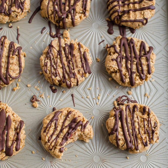 5-ingredient peanut butter granola cookies drizzled with chocolate.