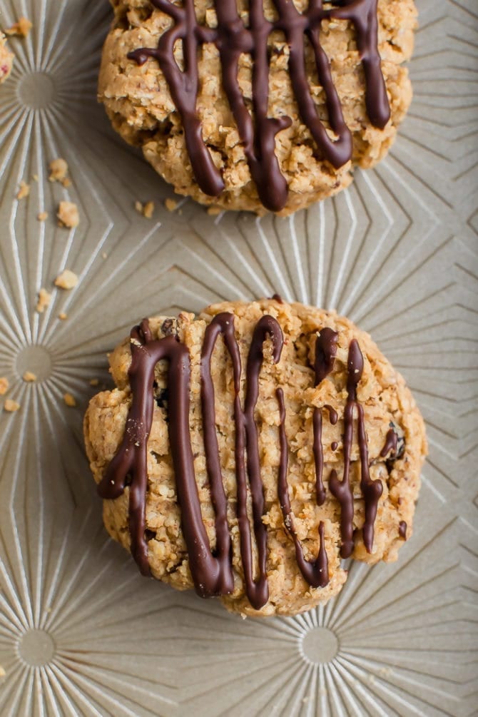 5-ingredient peanut butter granola cookies drizzled with chocolate.