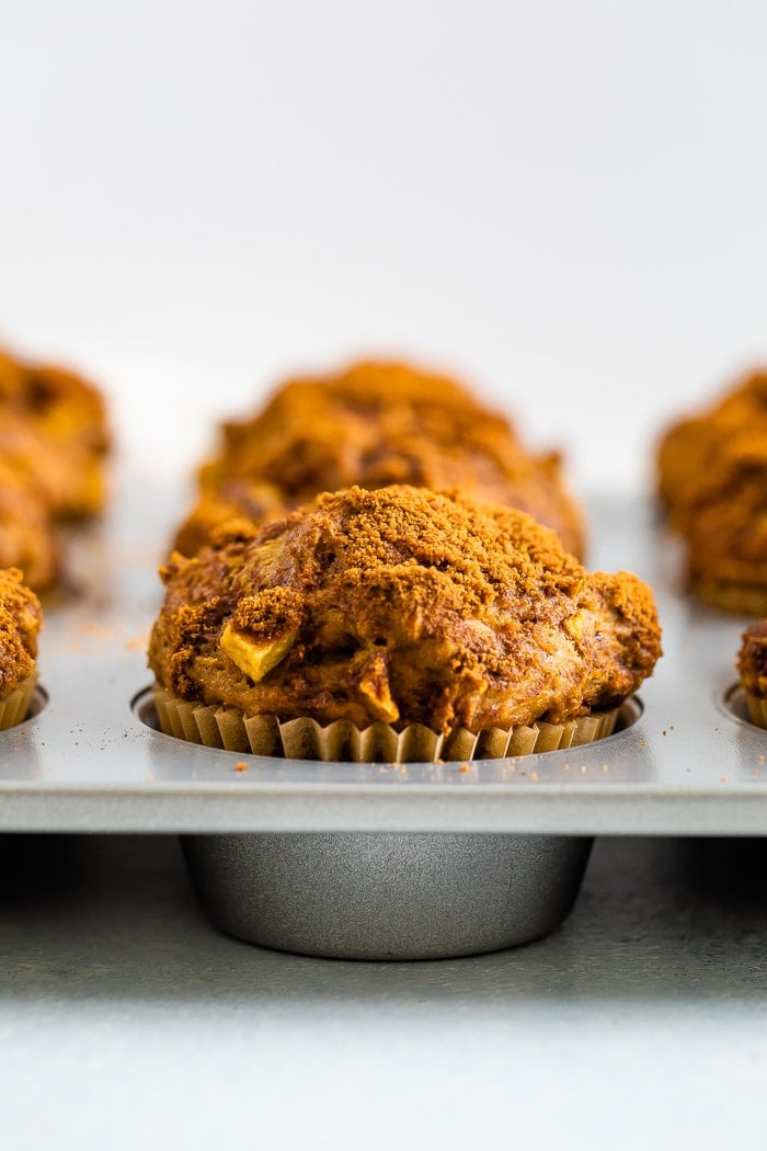 Healthy apple muffins in a muffin tin.