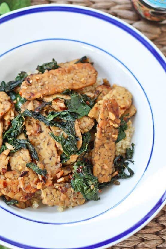 A flavorful one skillet meal with tempeh, sautéed kale and coconut aminos.