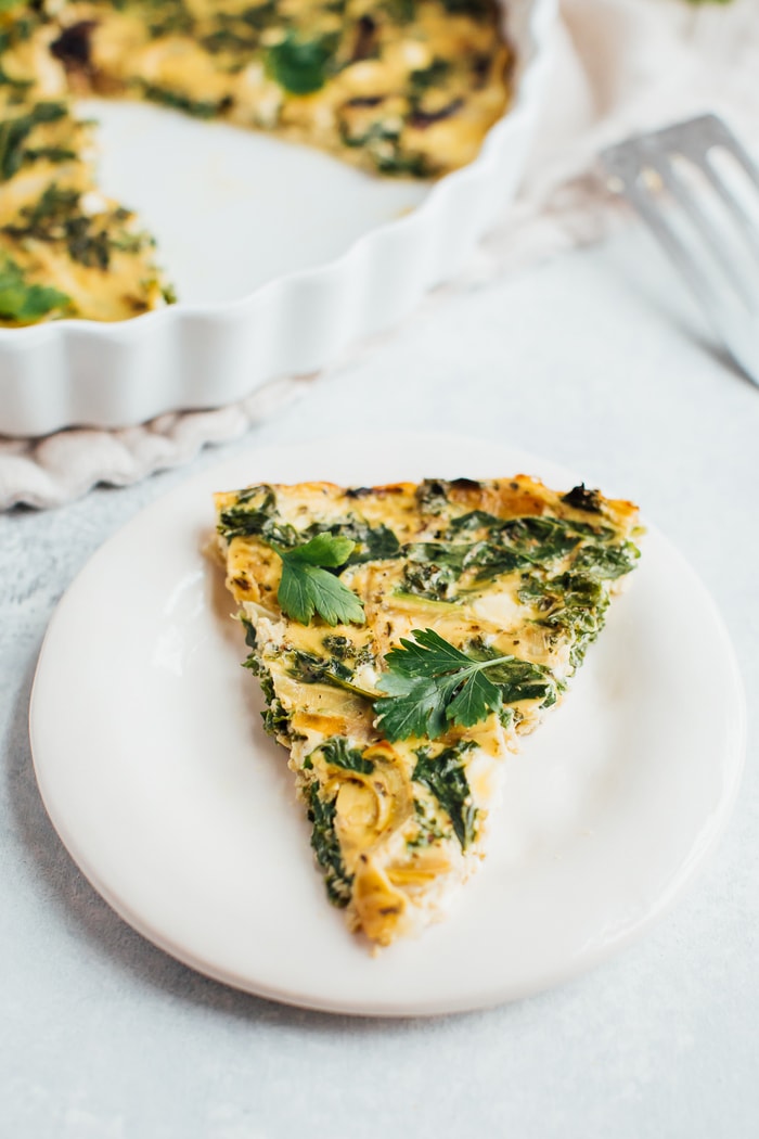 Up close shot of one slice of the kale and feta crustless quiche.