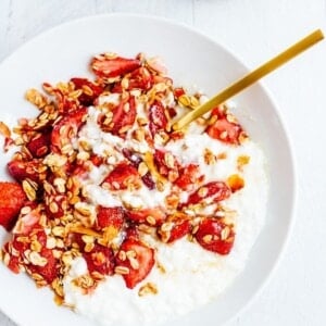 White bowl with cottage cheese and roasted strawberries