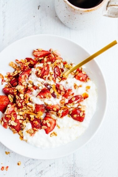 White bowl with cottage cheese and roasted strawberries