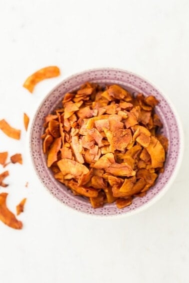 Vegan Coconut Bacon in a light pink bowl.