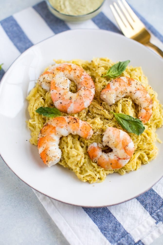 Pesto spaghetti squash topped with shrimp and basil.