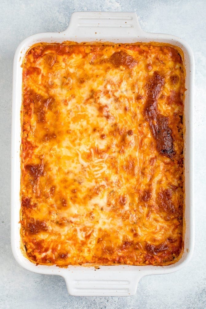 Baked tofu zucchini lasagna with meted mozzarella on top.