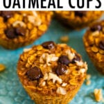 Four baked pumpkin oatmeal cups on a plate. Oatmeal cups are topped with walnuts and chocolate chips.