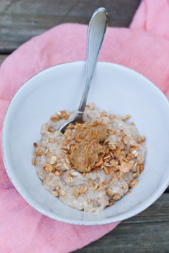 A bowl of oats with pumpkin almond butter.