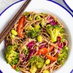 Plate with soba noodle salad with edamame and veggies.