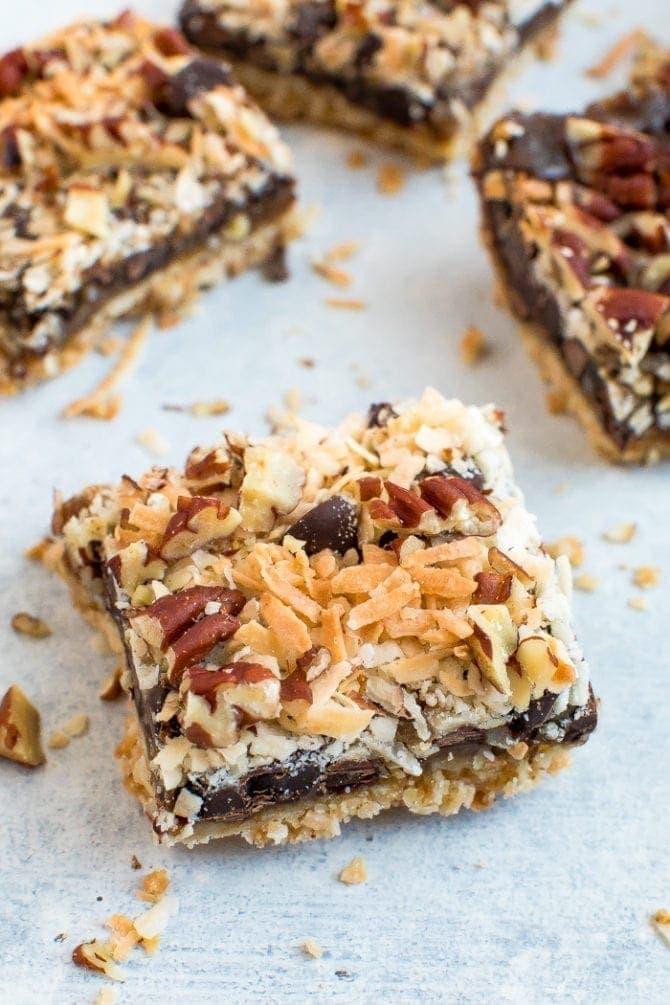 Healthier magic cookie bars. An almond flour cookie crust topped with coconut caramel, coconut, pecans, and chocolate chips.