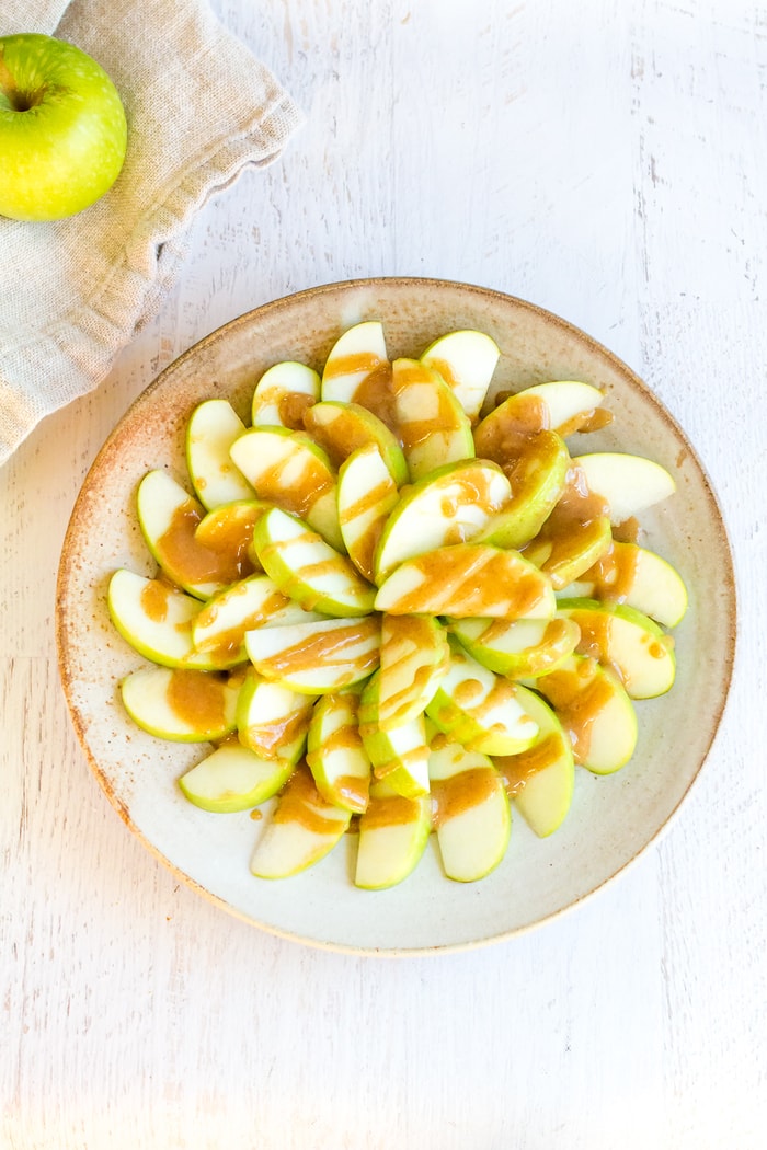 Sliced apples drizzled with the date caramel sauce.