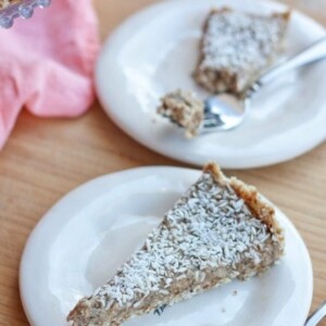 Two plates each with a slice of healthy coconut cream pie.