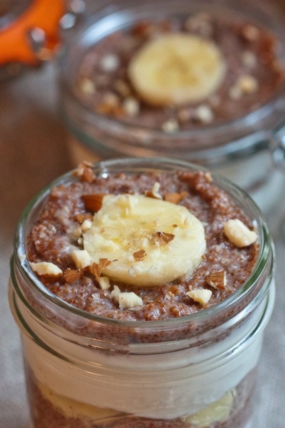 Banana Nut Teff Parfait A close up of Banana Nut Teff Parfait with a slice of banana centered on top.