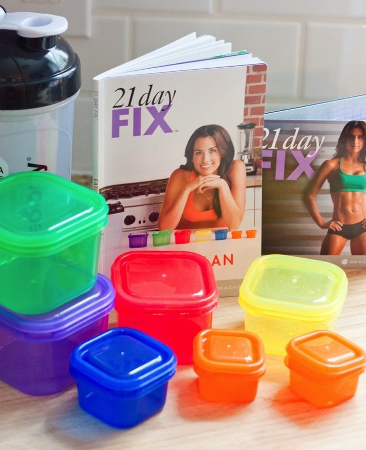 21 Day Fix book and plastic food storage containers.