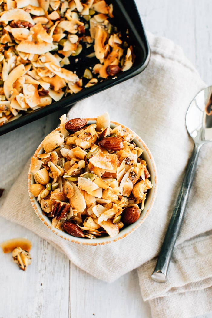 Overhead shot of a bowl with 5-Ingredient Grain Free Granola and a silver spoon.