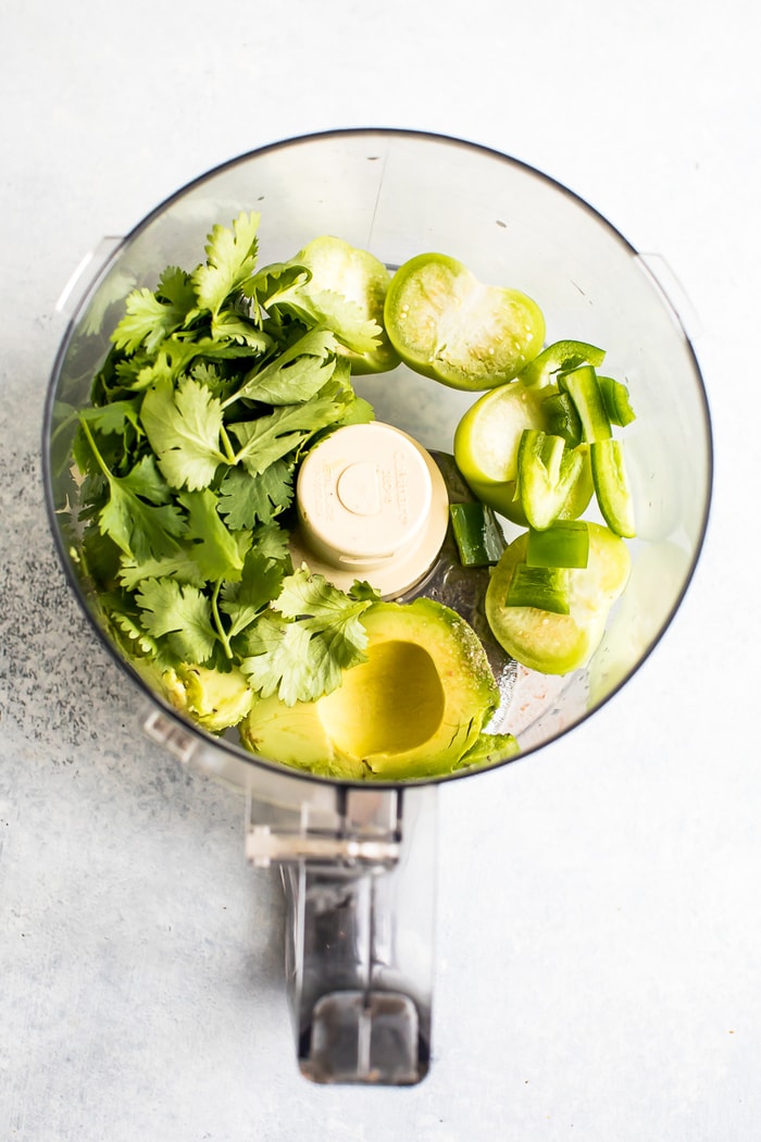 Chopt Mexican Goddess salad dressing ingredient in a blender, tomatillos, avocado and cilantro.