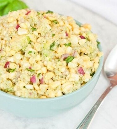 Fresh Corn, Avocado and Quinoa Salad (or dip) in a blue bowl.