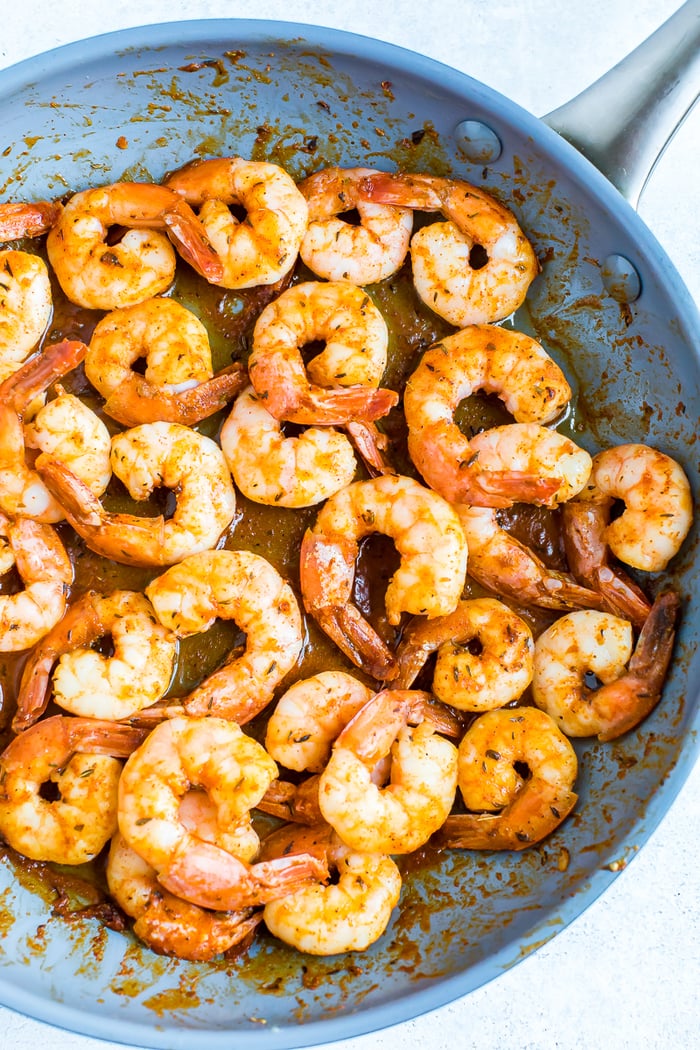 Pan with pan seared blacked shrimp.