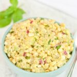 Fresh Corn, Avocado and Quinoa Salad (or dip) in a blue bowl.