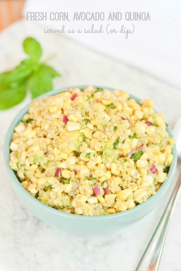 Fresh Corn, Avocado and Quinoa Salad (or dip) in a blue bowl.