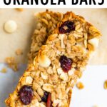 Two cranberry granola bars stacked.