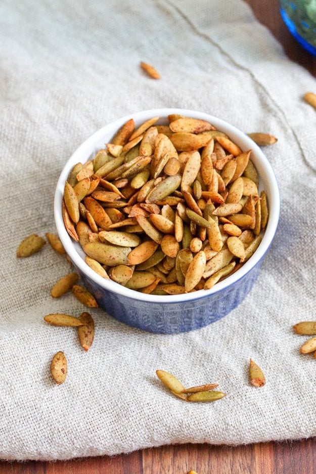 Pumpkin Spiced Roasted Pepitas Pumpkin Spiced Roasted Pepitas in a small dish.