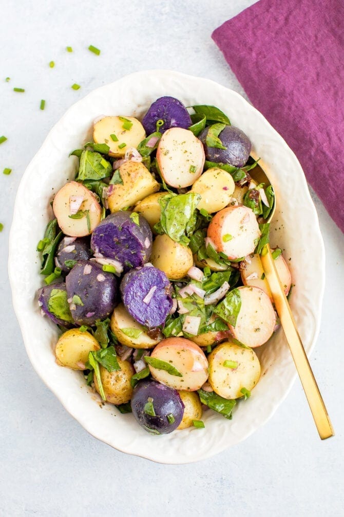 Tri-colored fingerling potato salad with shallots and spinach.