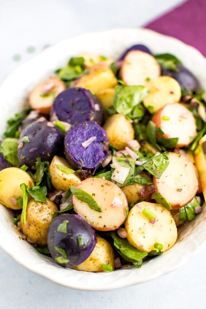 Tri-colored fingerling potato salad with shallots and spinach.