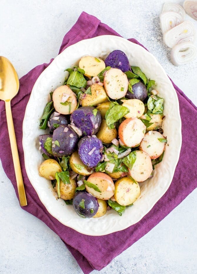 Tri-colored fingerling potato salad with shallots and spinach.