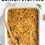 Casserole dish with baked quinoa stuffing topped with pecans.