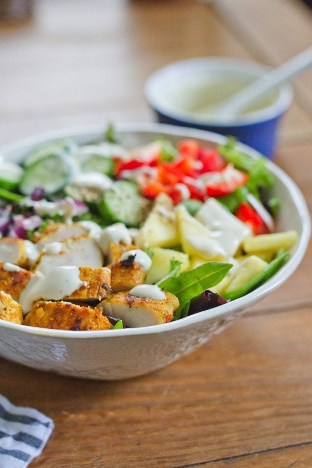 Thai Curry Chicken Salad with a Creamy Dijon Dressing served on a wood table. 