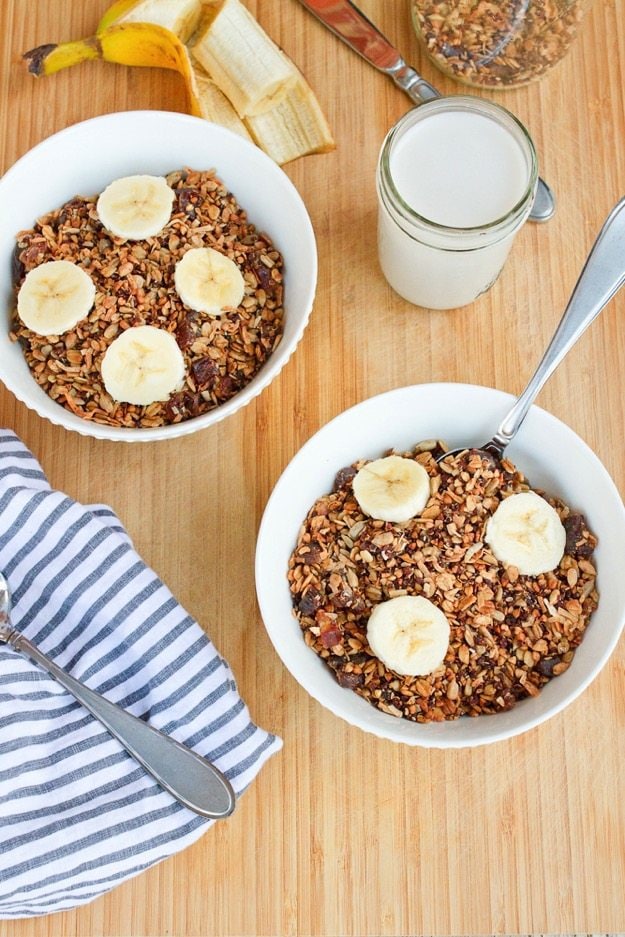 Two bowls of Homemade Gluten-free Cereal with Quinoa Buckwheat & Dates.