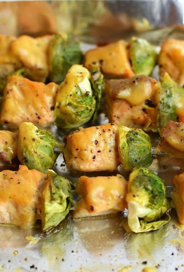 Maple Dijon Baked Salmon Skewers by Fit Foodie Finds Maple Dijon Baked Salmon Skewers on tinfoil