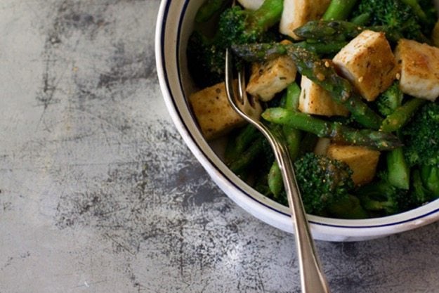 Miso Vegetables with Tofu in a white bowl on distressed countertop