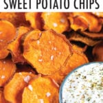 Homemade sweet potato chips next to a bowl of creamy and herby dip.