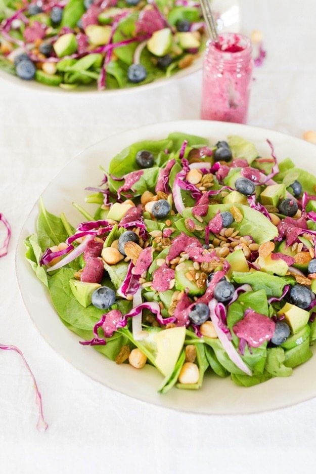 Antioxidant Salad with Blueberry Tahini Dressing, spinach salad with avocado, berries and nuts.