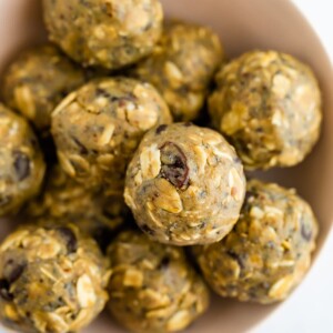 Energy bites made with sunbutter in a pink bowl.