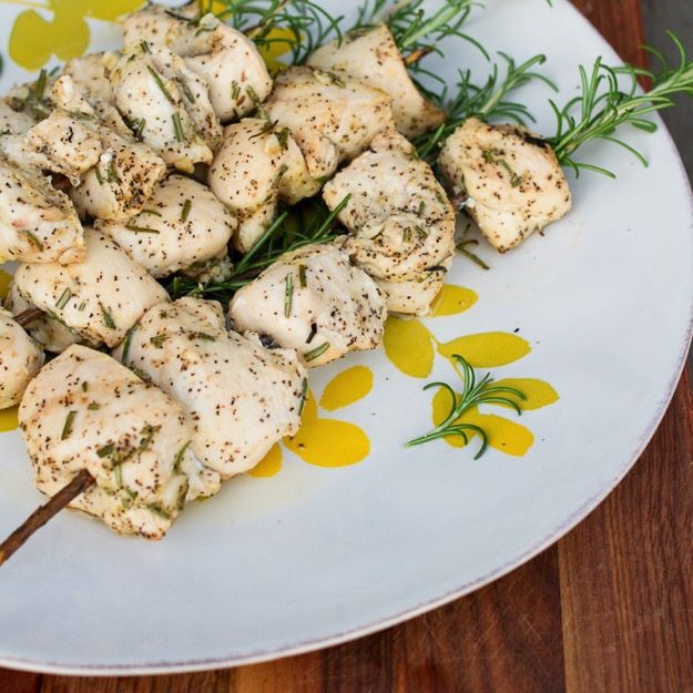 A plate of rosemary chicken skewers.