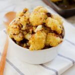 A small dish of roasted curried cauliflower.
